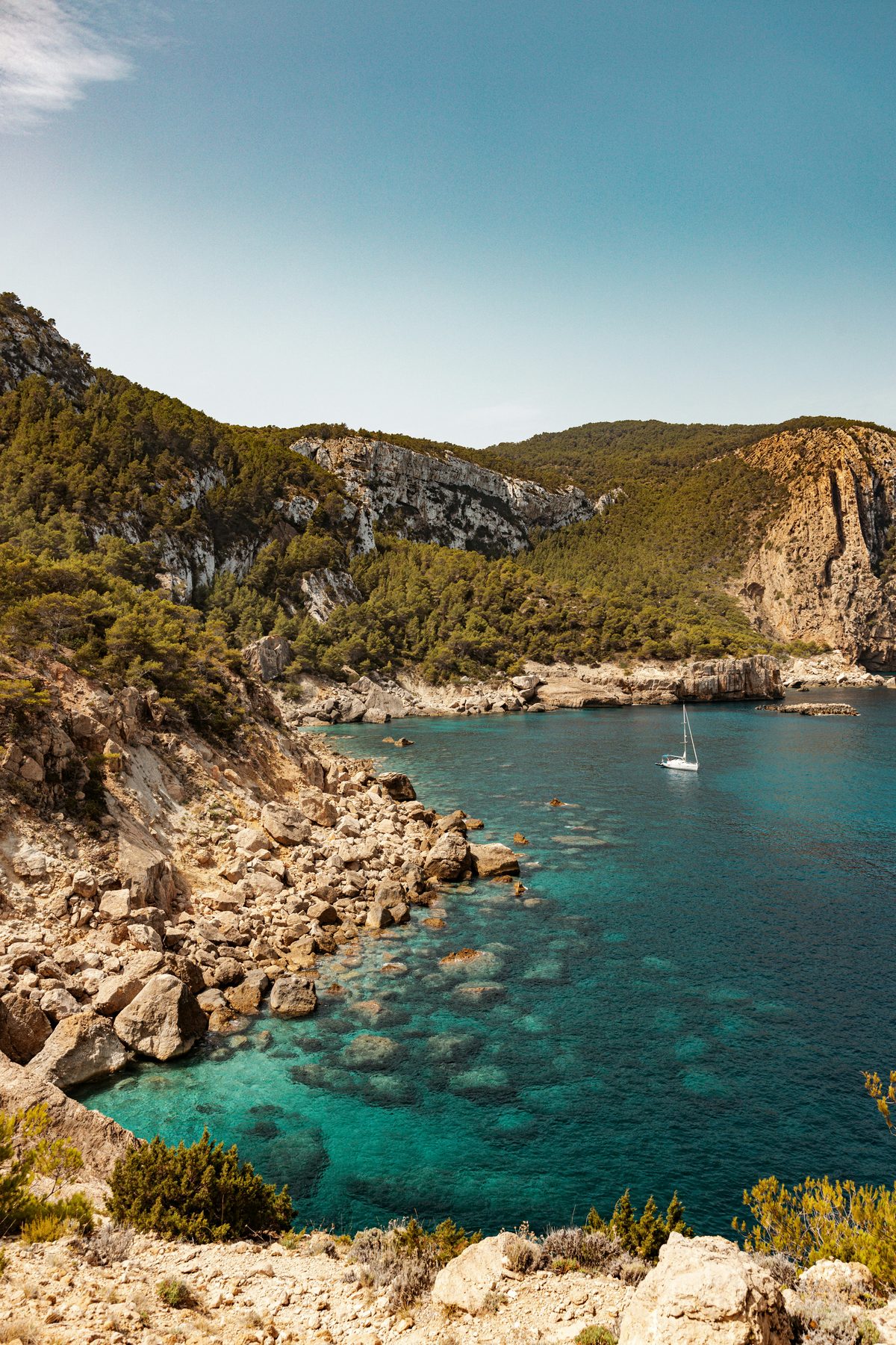 A sailboat in a cove