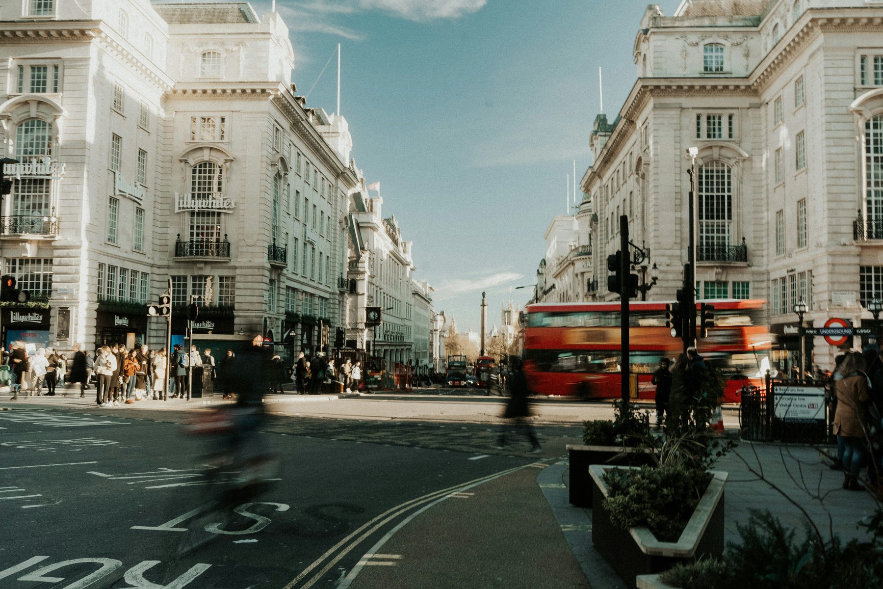 A city street with a red bus