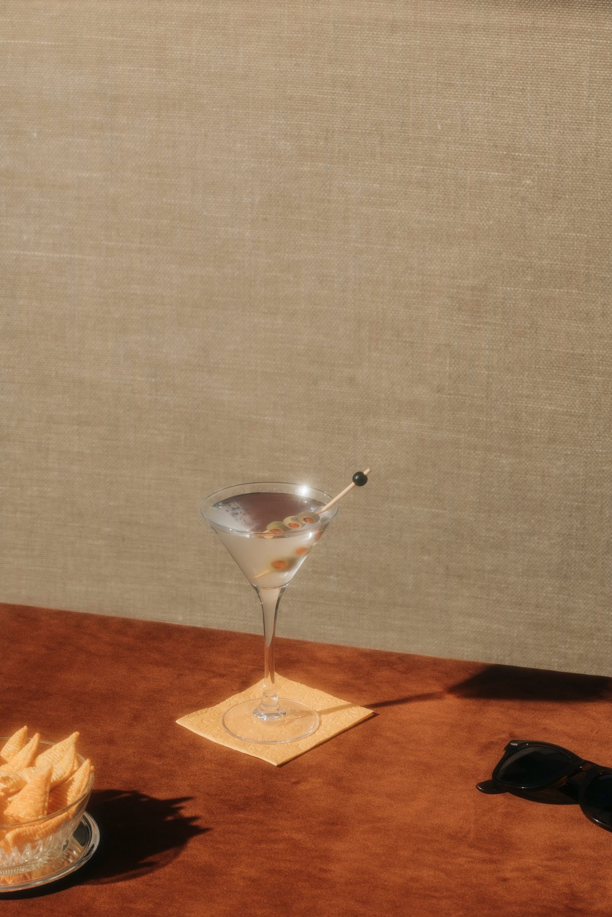 A martini on a table in the sun