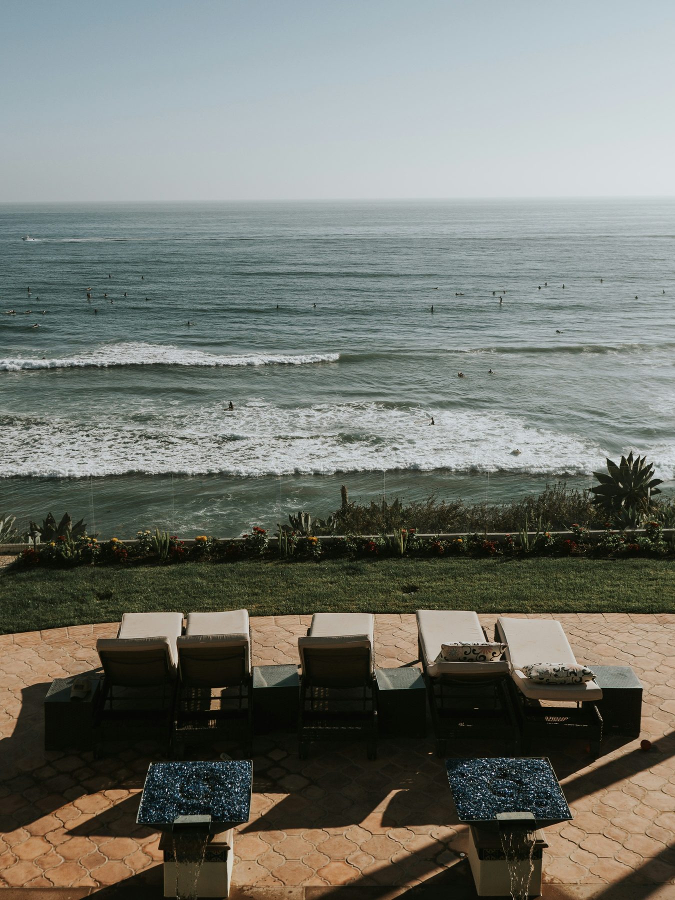 Loungers on a terrace above the sea