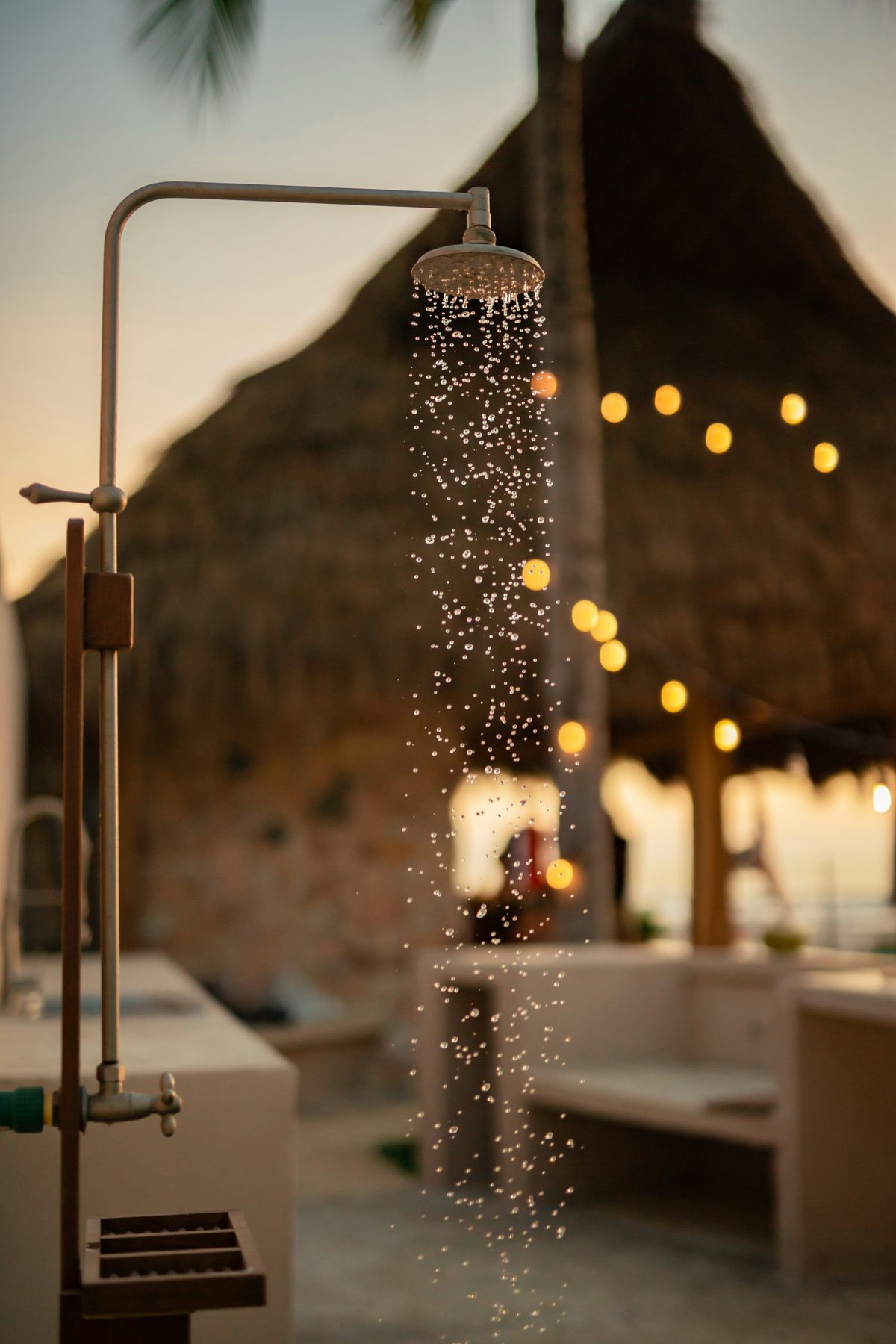 An outdoor shower at dusk